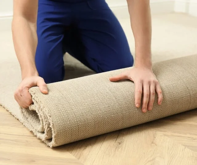 Carpet To Go installer fitting new carpet in a customer's home
