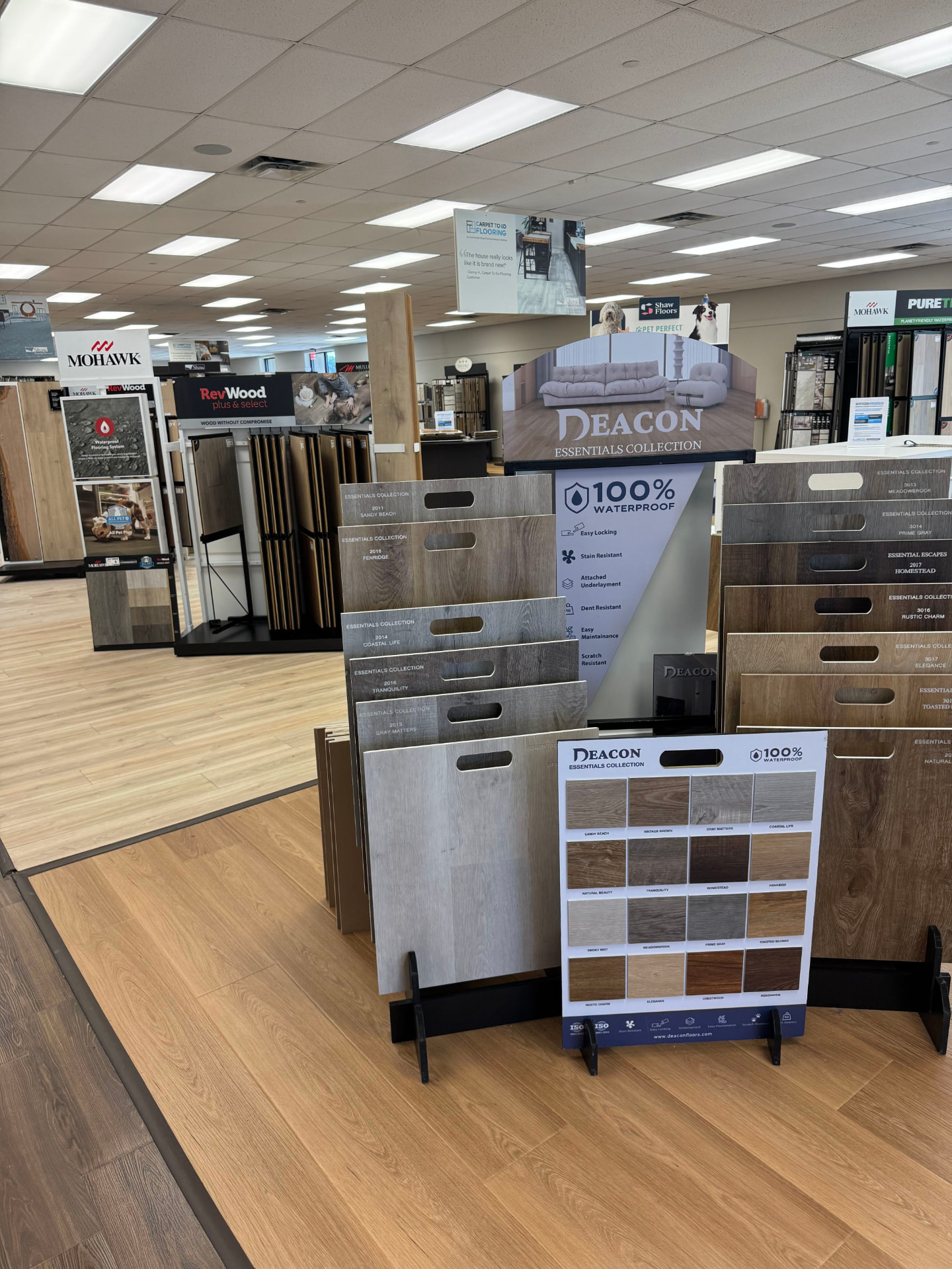Carpet To Go Flooring showroom with hardwood, vinyl, and carpet displays