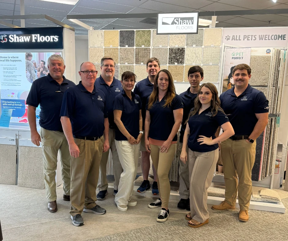 The Carpet To Go Flooring sales, design and operations team in the Charleston showroom